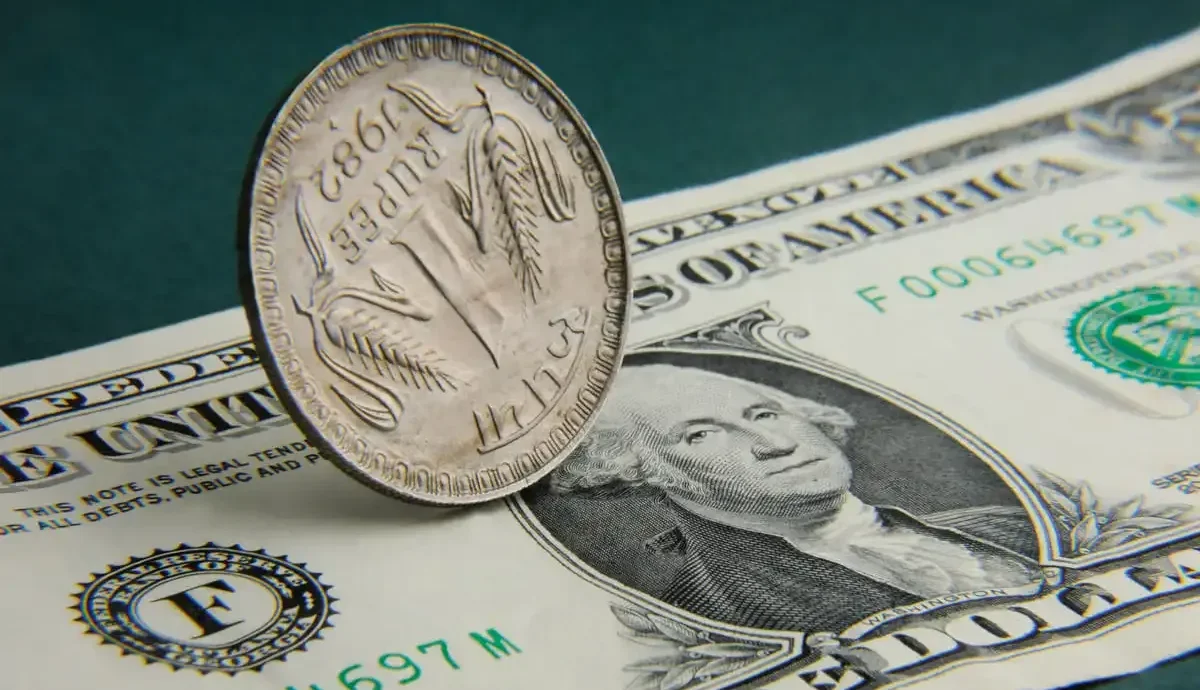 Rupee falls, value against dollar hits record high