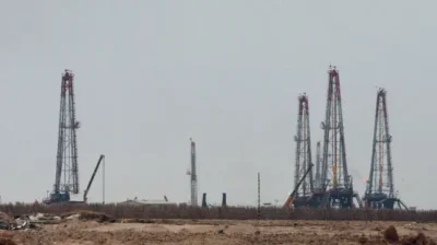 Iraq oil production cut 2026 Strait of Hormuz closed